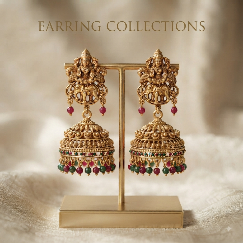 Antique gold Lakshmi jhumka earrings with ruby and emerald beads